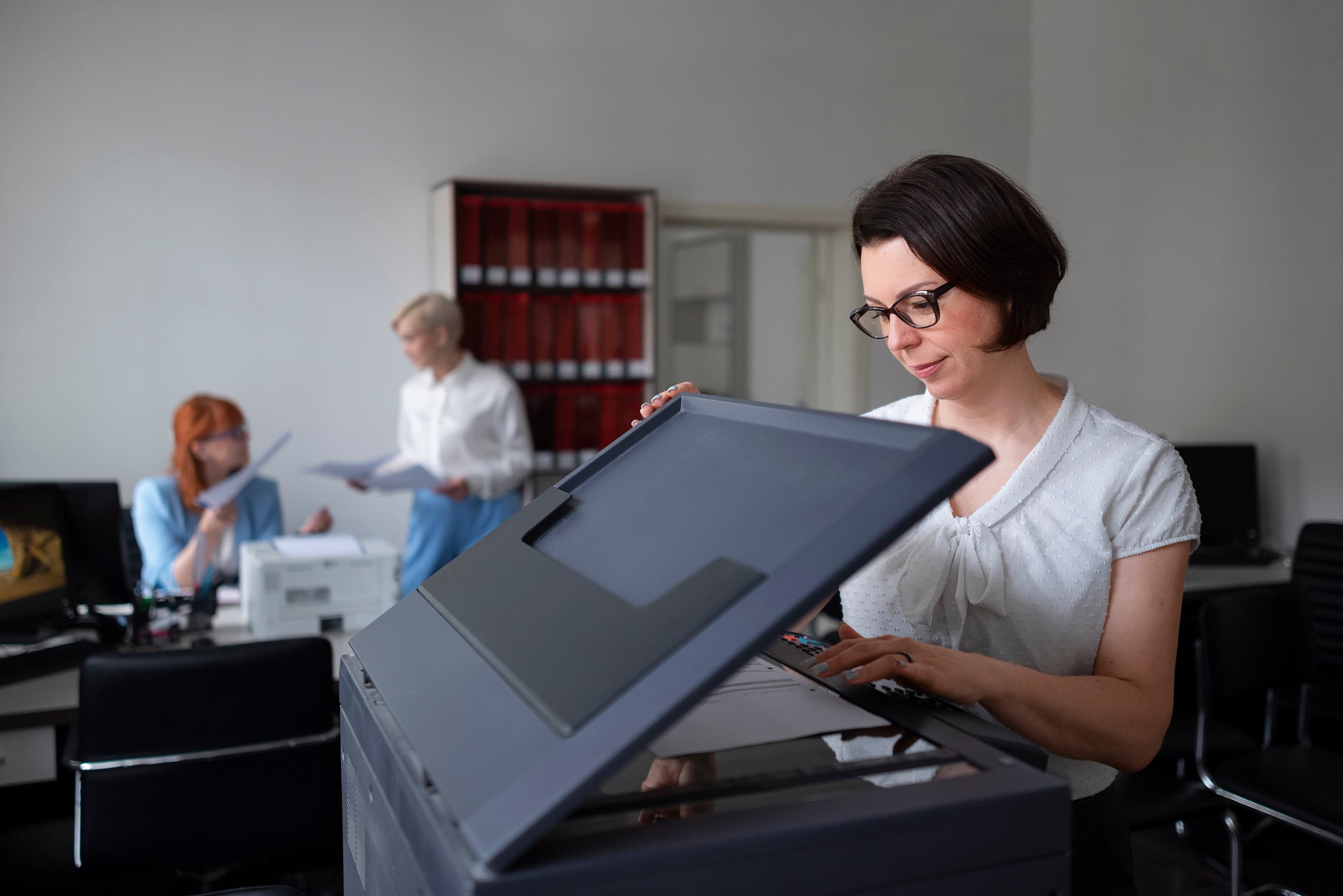 Office worker using a New Era managed printer